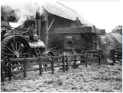 Threshing machine driven by a steam engine